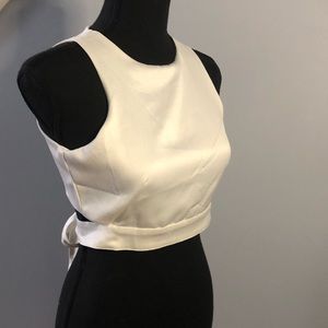 White satin crop top. Zipper/tie back